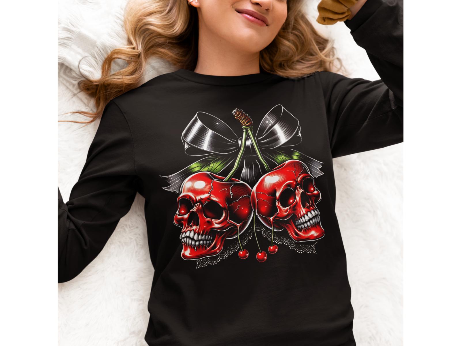 A woman wears a black long-sleeve shirt with a spooky cherry and skull design.