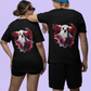 Two people wear black t-shirts with a creepy ghost design on the back.