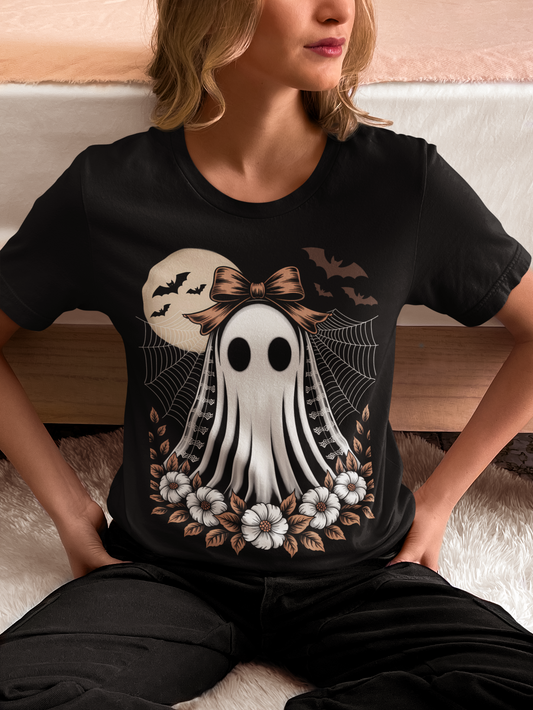A woman wears a black t-shirt with a vintage lace ghost design.