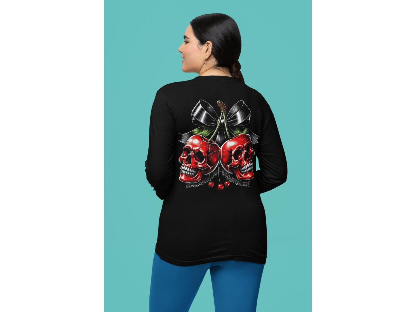 A woman from behind wears a black long-sleeve shirt with a cherry skull design.