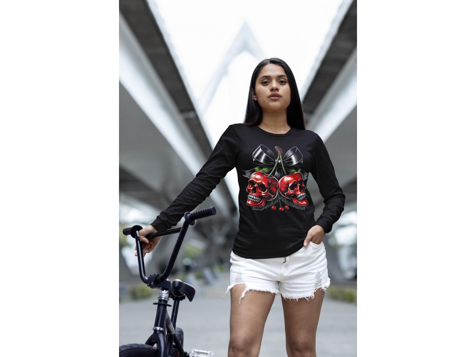 A woman wears a black long-sleeve shirt with a spooky cherry Halloween bow design.