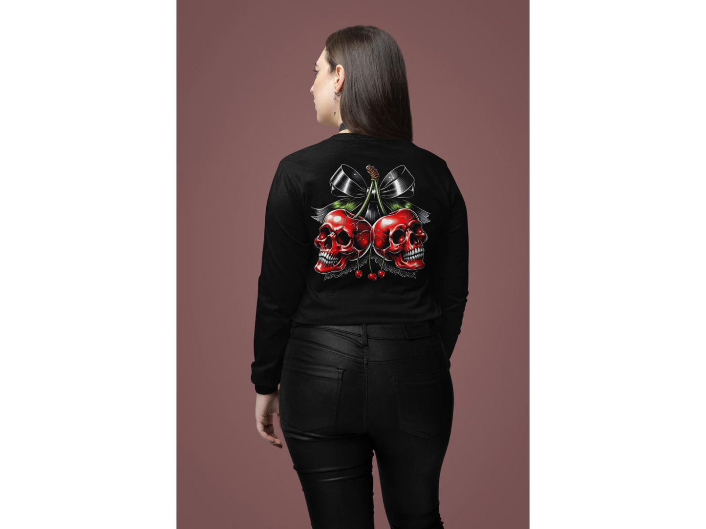 A woman from behind wears a black sweatshirt with a cherry skull design.