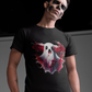 A man in skull makeup wears a black t-shirt with a creepy ghost design.