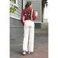A woman from behind wears a red long-sleeve shirt with a spooky cherry design.