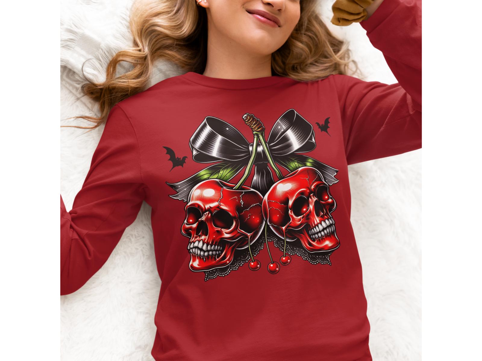 A woman wears a red long-sleeve shirt with a spooky cherry and skull design.