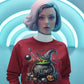 A woman wears a red sweatshirt with a "Happy Halloween" cauldron design.