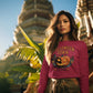 A woman wears a maroon Halloween Town sweatshirt with a vintage pumpkin graphic.