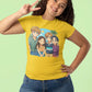 A woman in a yellow t-shirt with an anime design of four friends at the beach.