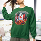 A woman wears a green sweatshirt with a Canadian Halloween ghost and pumpkin design.