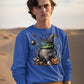 A man in a blue "Happy Halloween" sweatshirt stands in a desert landscape.