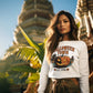A woman wears a white Halloween Town sweatshirt with a pumpkin graphic.