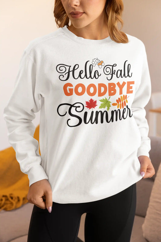 A woman wears a white sweatshirt with "Hello Fall GOODBYE Summer" text and autumn leaves.