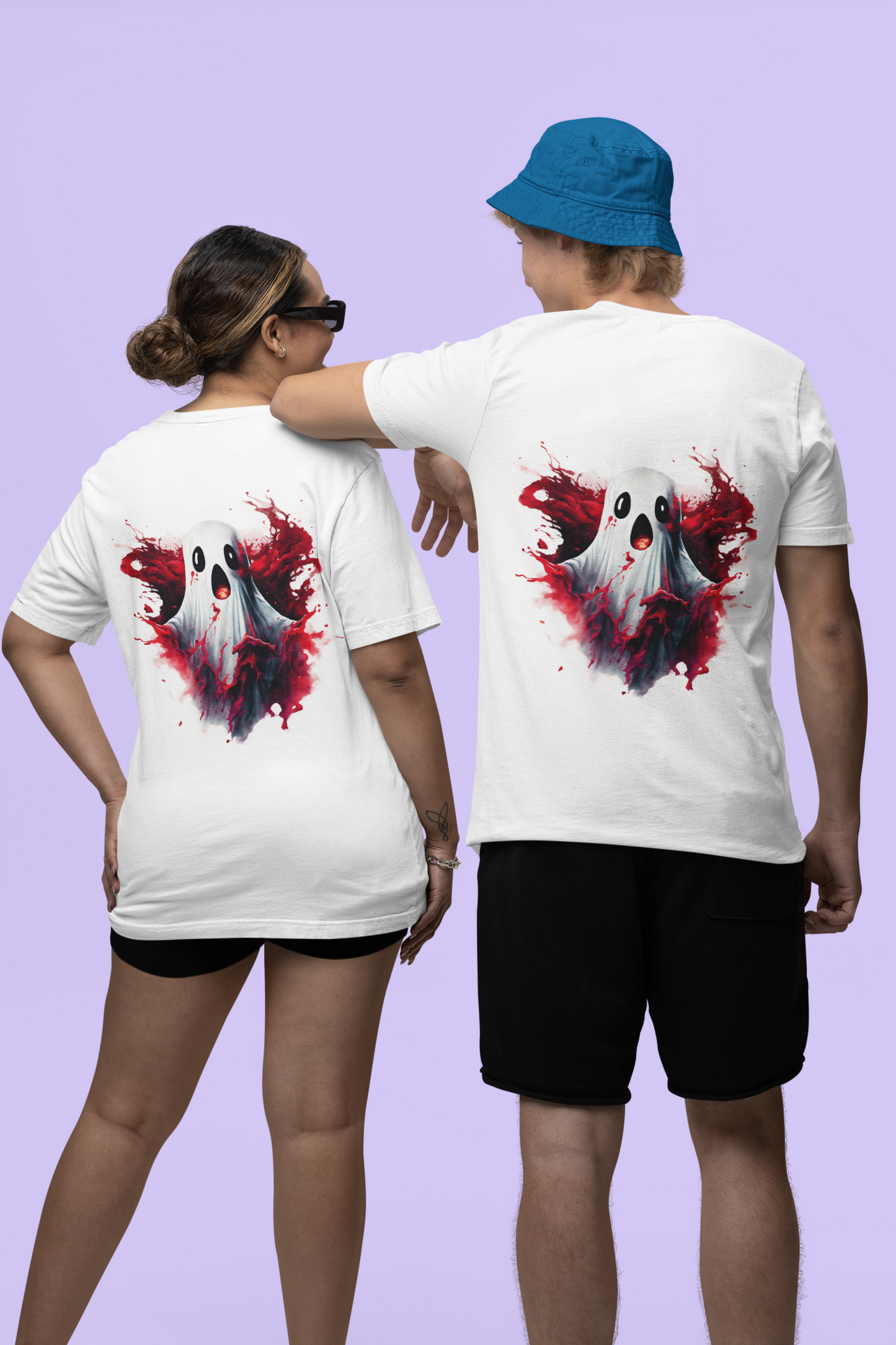 Two people wear white t-shirts with a creepy ghost and red splatter design on the back.