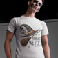 A man with skull makeup wears a white t-shirt with a witch hat and broom graphic.