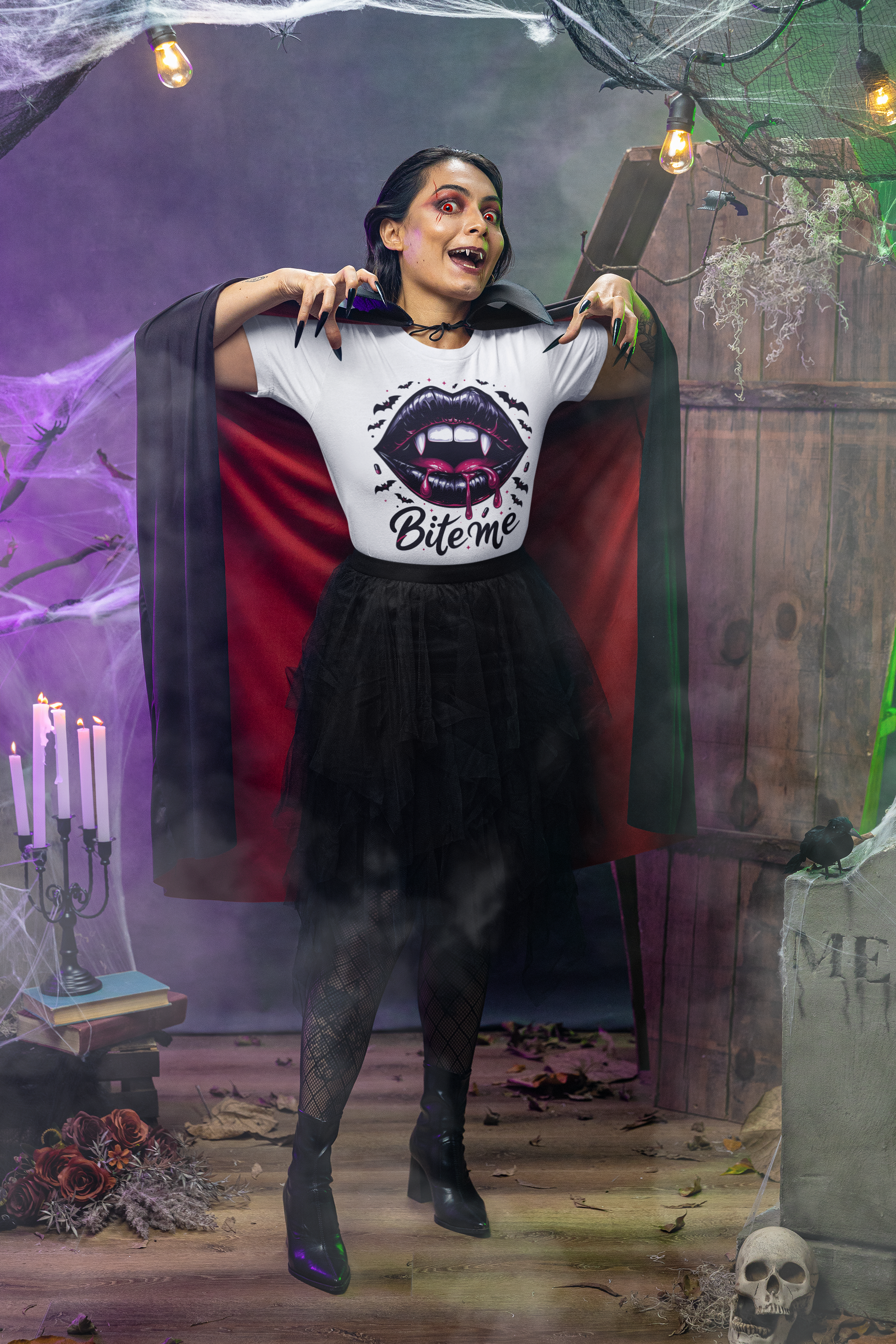 A woman in a vampire costume wears a white t-shirt with a "Bite Me" graphic.