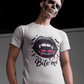 A man in skull makeup wears a white t-shirt with a "Bite me" vampire lips graphic.