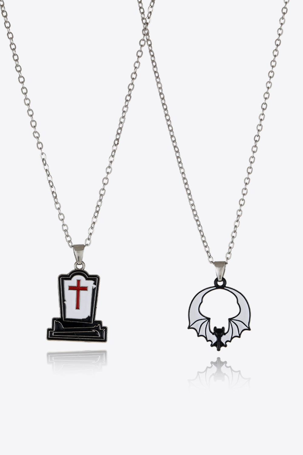 Two-piece Halloween theme necklace set with a gravestone and a bat pendant.
