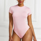 A base layer for a shaping garment