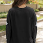 Black ribbed long-sleeve top and shorts set with glitter ghost details.