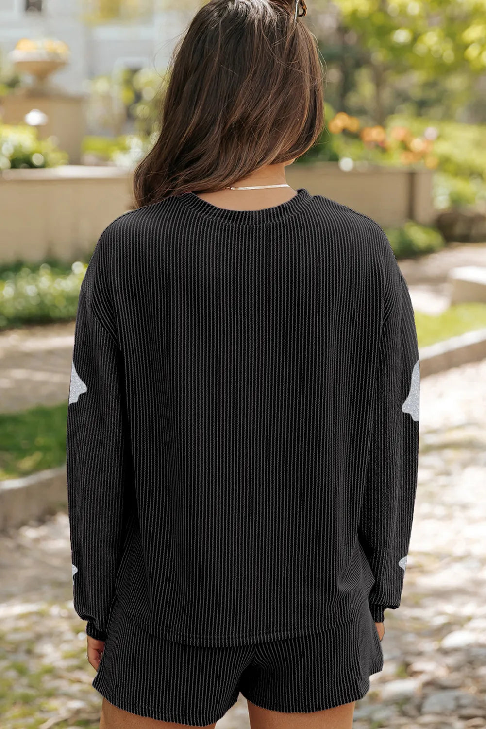 Black ribbed long-sleeve top and shorts set with glitter ghost details.