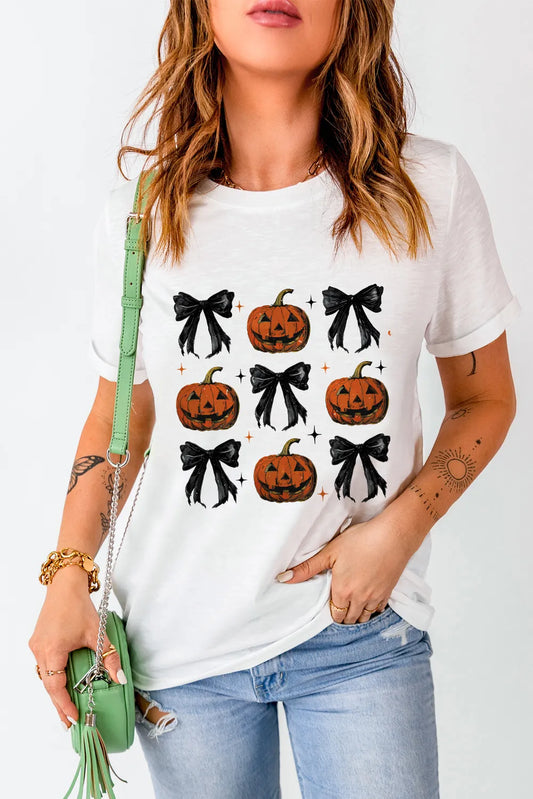 White short-sleeve t-shirt with a pumpkin and bow pattern.