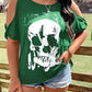 Plus size green cold shoulder t-shirt with a white skeleton graphic.