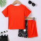 Children's orange short-sleeve t-shirt and black spiderweb shorts set.