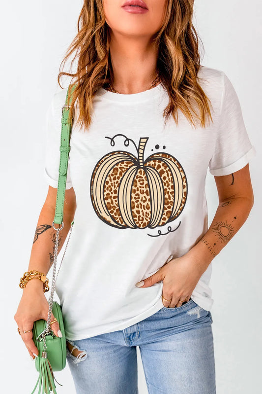 A woman wears a white short-sleeve t-shirt with a leopard print pumpkin design.