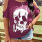 Plus size cold shoulder t-shirt with a white skeleton graphic.