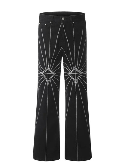 Men's black flared jeans with white spider web embroidery.