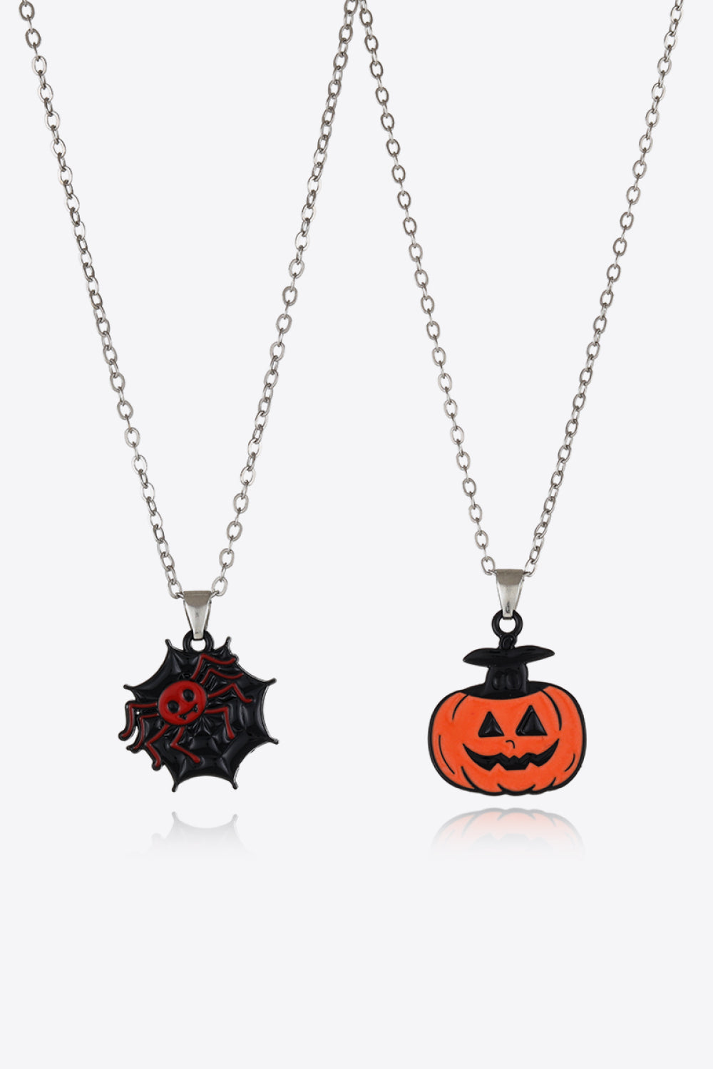 Two-piece Halloween theme necklace set with a spiderweb and pumpkin pendant.