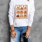 White round neck sweatshirt with a pumpkin graphic.
