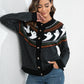 Black button-up long-sleeve cardigan with white ghost pattern.