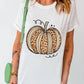 A woman wears a white short-sleeve t-shirt with a leopard print pumpkin design.