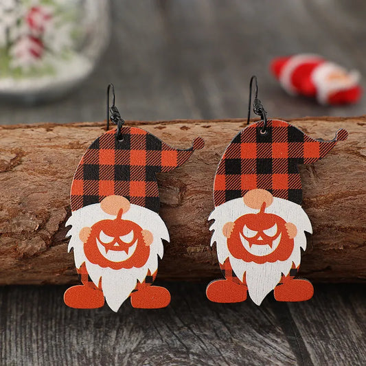 Wooden dangle earrings featuring two dwarfs with plaid hats and pumpkin faces.