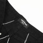 Black flared jeans with white spider web embroidery and a "11KN BRAND UNISEX" tag.