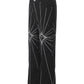 Men's black flared jeans with white spider web embroidery.