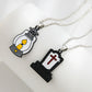 Two necklaces, one with a lantern pendant and the other with a tombstone pendant.