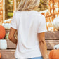 Pumpkin Round Neck Short Sleeve T-Shirt in light pink, worn with a denim skirt.