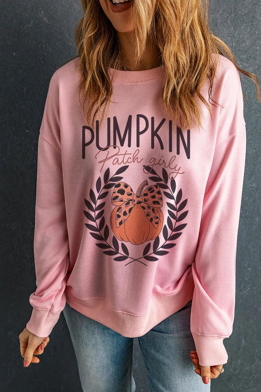 Pink long-sleeve sweatshirt with "Pumpkin Patch Girly" text and a pumpkin graphic.