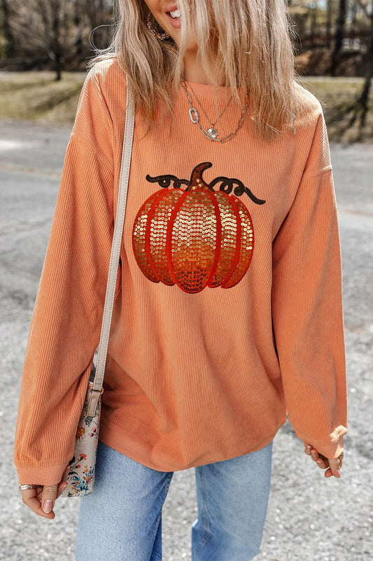 Sequin pumpkin round neck long sleeve sweatshirt.