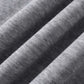 Close-up of the gray fabric of the hoodie, showing its texture and folds.