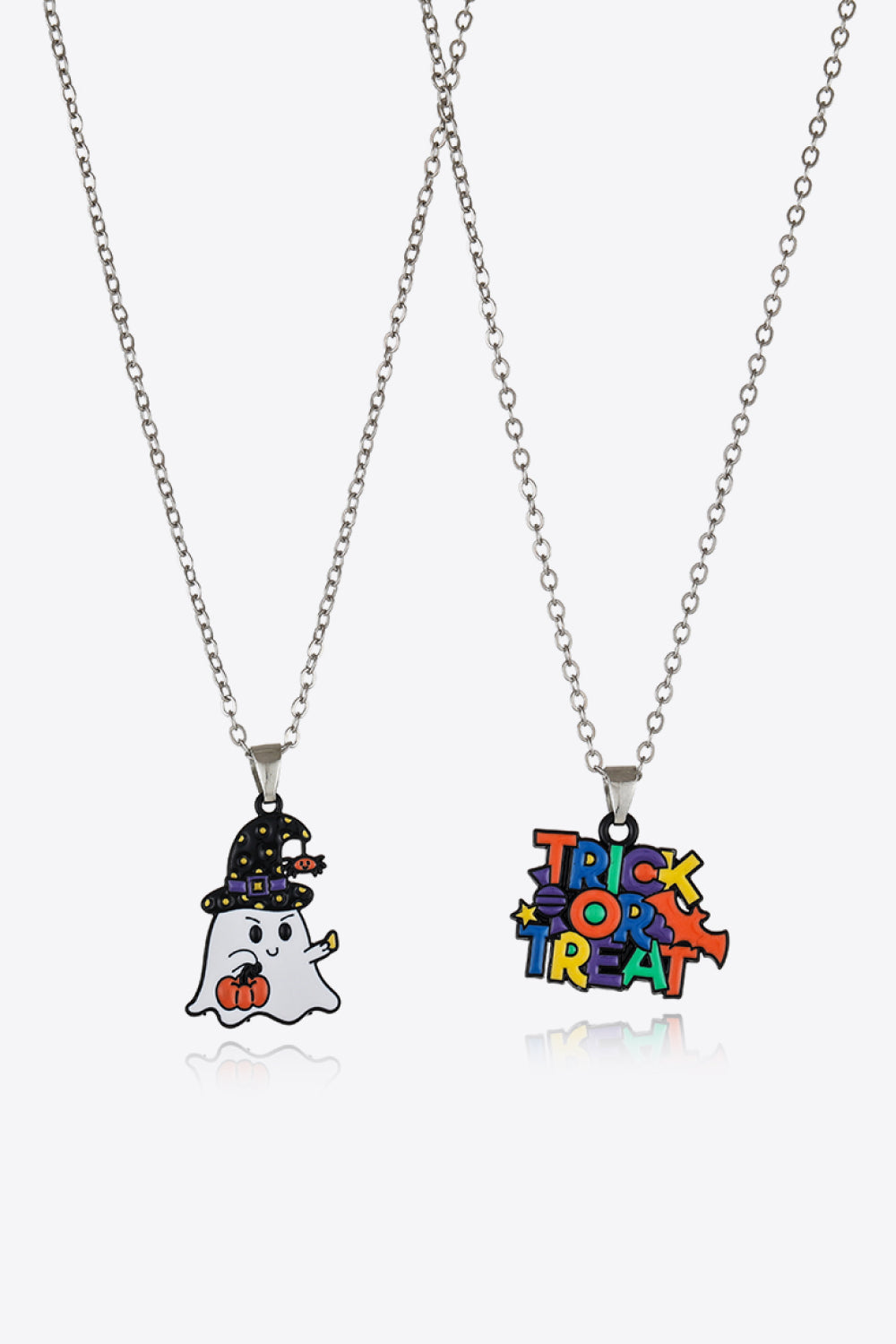 Two silver chain necklaces with Halloween-themed pendants.