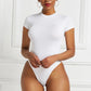 A base layer for a shaping garment
