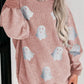 Oversized pink corduroy sweatshirt with glitter ghost graphics.