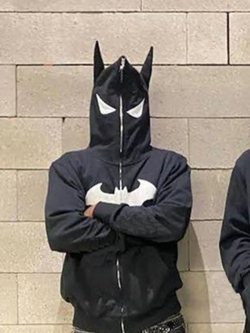 Men's black zip-up hoodie with a Batman logo and mask hood.