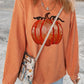 Orange corduroy long-sleeve sweatshirt with a sequin pumpkin design.