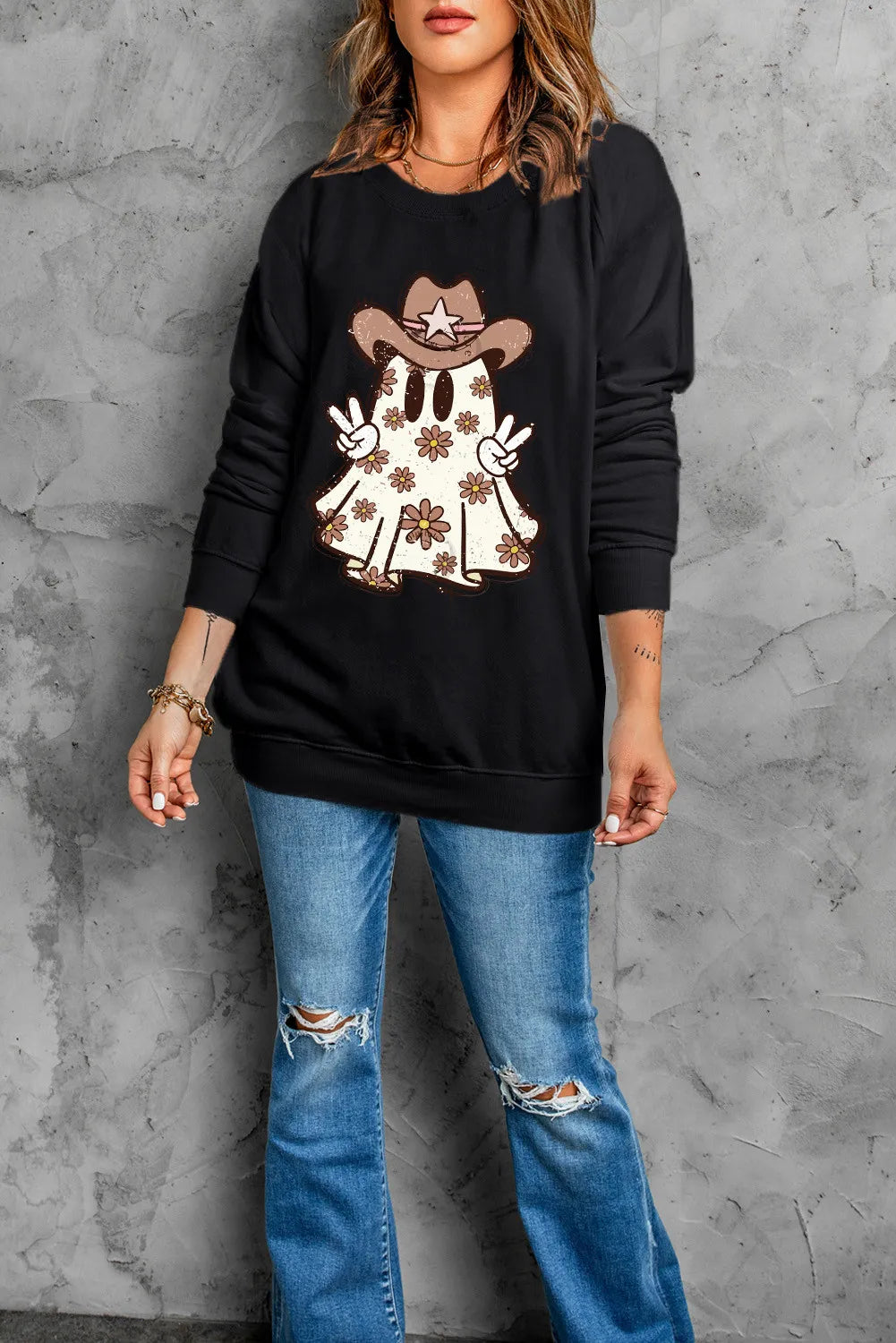 Black long-sleeve sweatshirt with a ghost wearing a cowboy hat and peace signs.