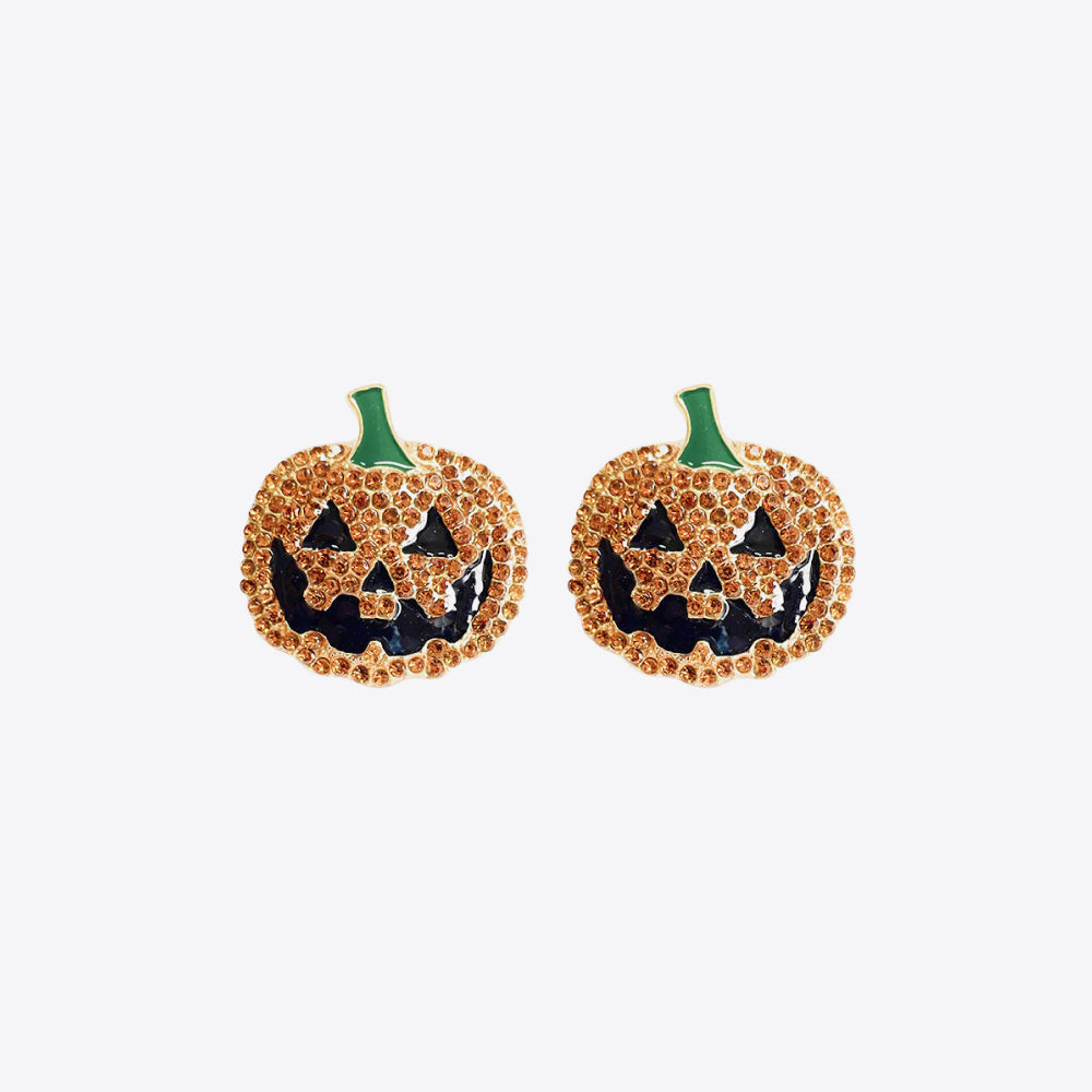 Two rhinestone pumpkin earrings with black jack-o'-lantern faces and green stems.