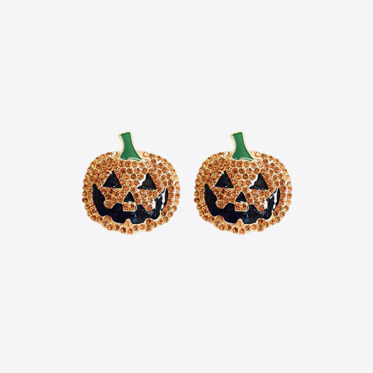 Two rhinestone pumpkin earrings with black jack-o'-lantern faces and green stems.